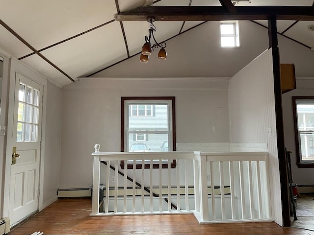 foyer entrance with plenty of natural light and a baseboard heating unit