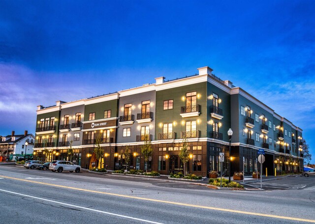 view of outdoor building at dusk