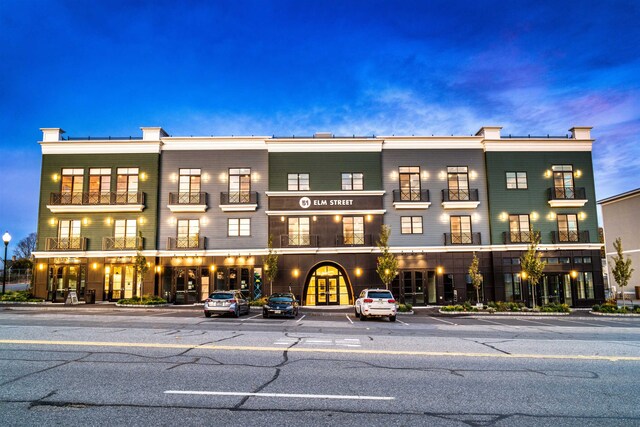 view of outdoor building at dusk