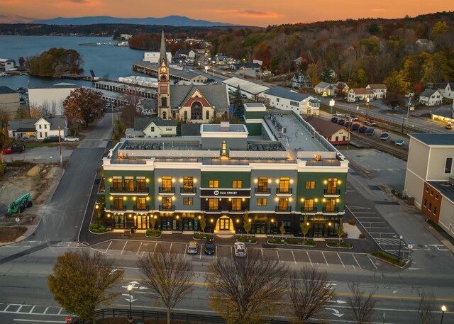 aerial view at dusk with a water view