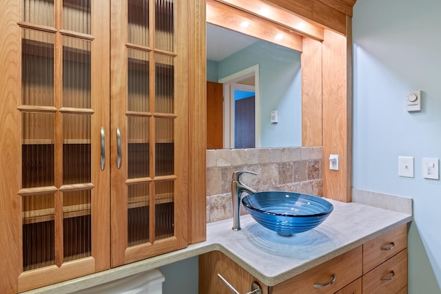 bathroom featuring backsplash and vanity