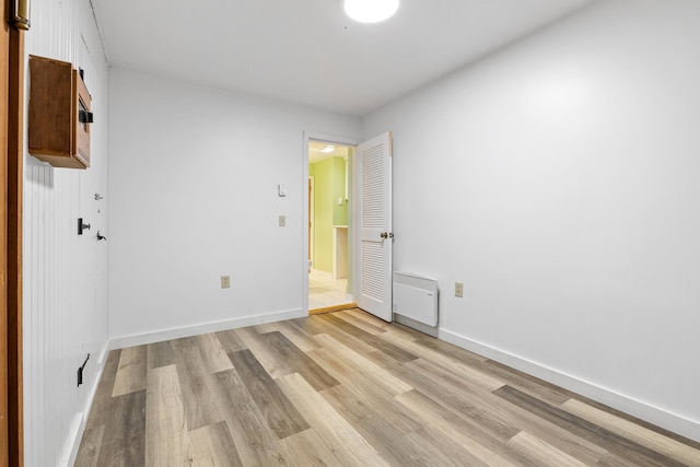 unfurnished room featuring light hardwood / wood-style floors