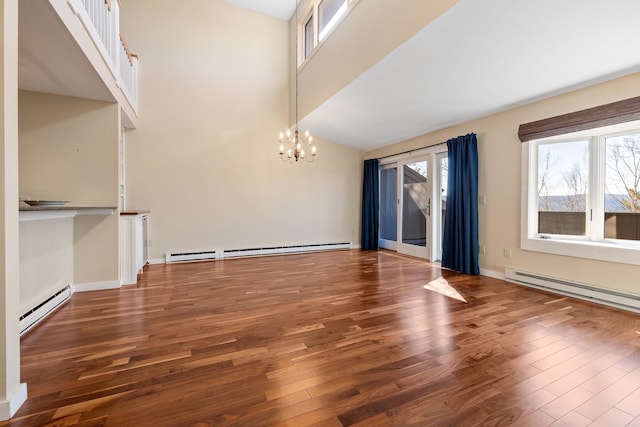 interior space with a chandelier, baseboard heating, and dark hardwood / wood-style floors