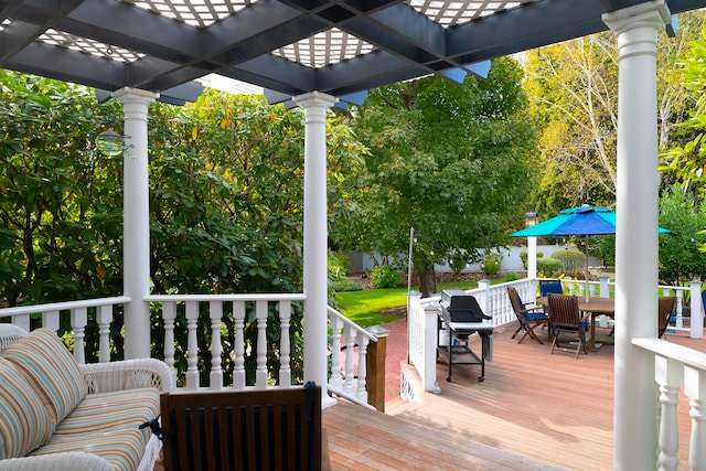 wooden deck featuring a pergola