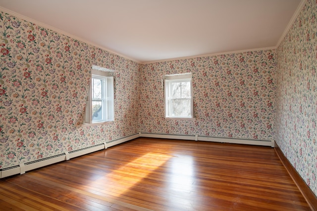 unfurnished room with hardwood / wood-style floors and crown molding