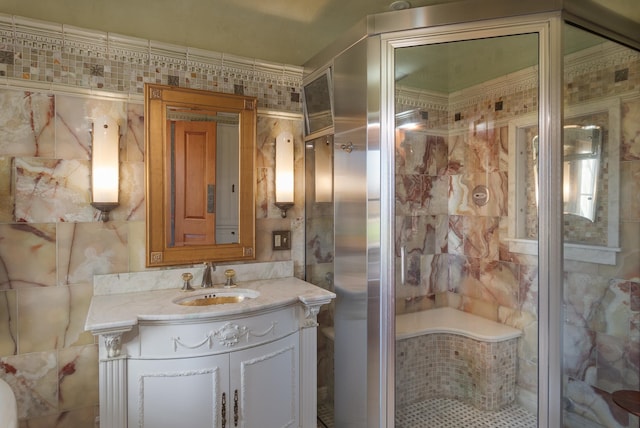 bathroom featuring an enclosed shower and vanity