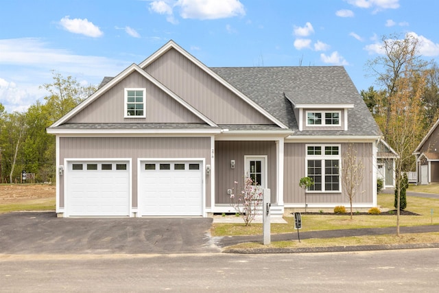 276 Sterling Dr, Laconia, NH 03246 - view of front of home with driveway, a shingled roof, and an attached garage