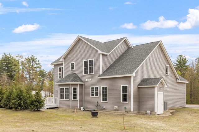 276 Sterling Dr, Laconia, NH 03246 - rear view of property featuring a shingled roof, a yard, a wooden deck, and cooling unit