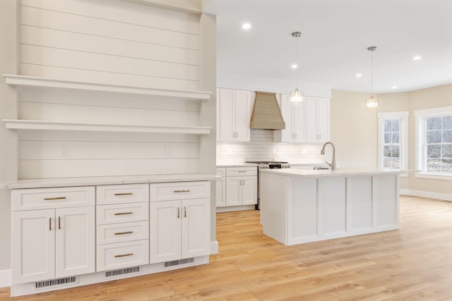 276 Sterling Dr, Laconia, NH 03246 - kitchen with open shelves, high end stainless steel range, premium range hood, a sink, and recessed lighting