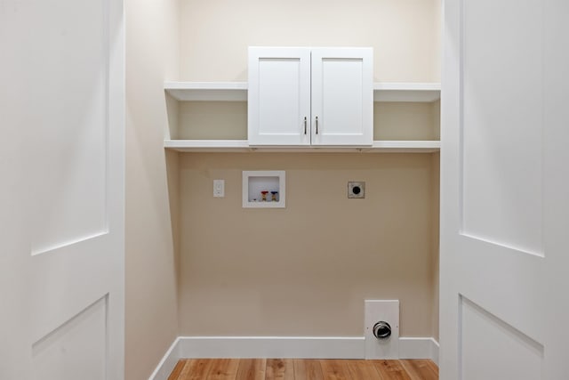 276 Sterling Dr, Laconia, NH 03246 - laundry area with cabinet space, washer hookup, light wood-style floors, hookup for an electric dryer, and baseboards