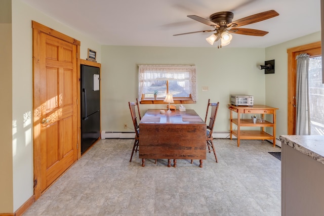 dining space with baseboard heating and ceiling fan