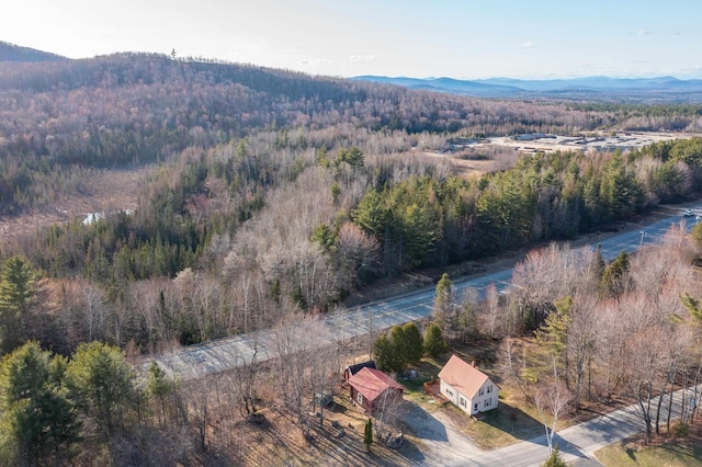 bird's eye view with a forest view and a mountain view
