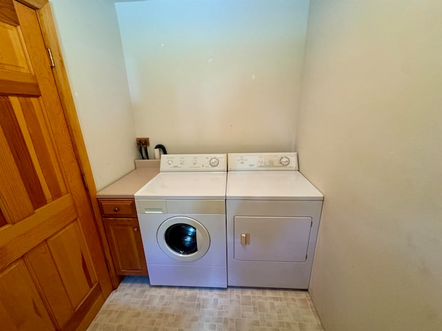 laundry area with cabinets and washer and dryer