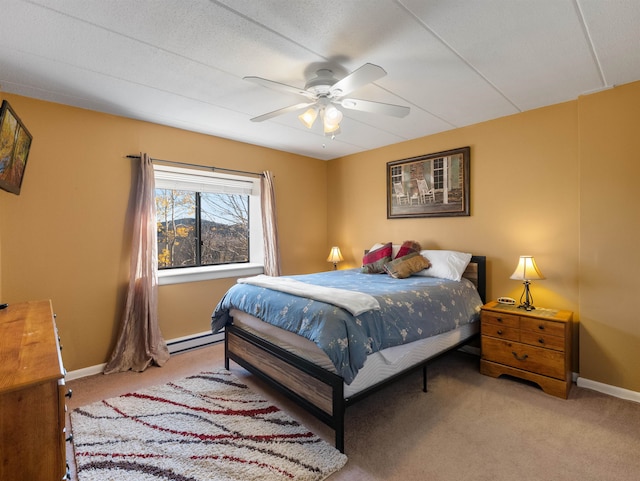 bedroom featuring carpet flooring, baseboard heating, and ceiling fan