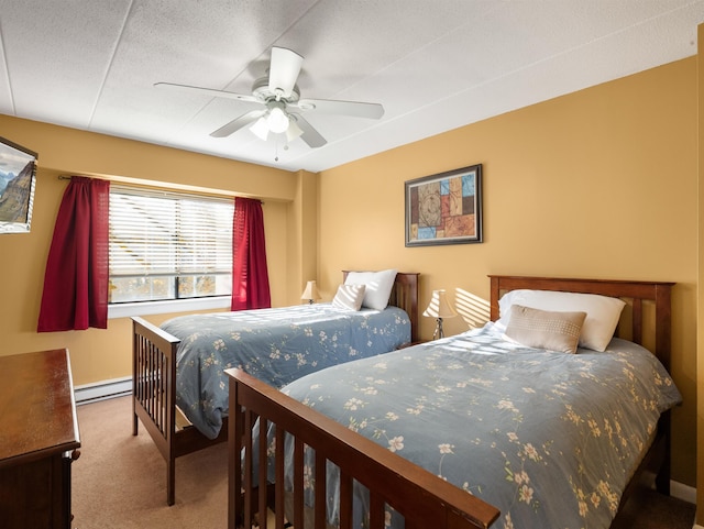 carpeted bedroom featuring ceiling fan, a baseboard radiator, and a textured ceiling