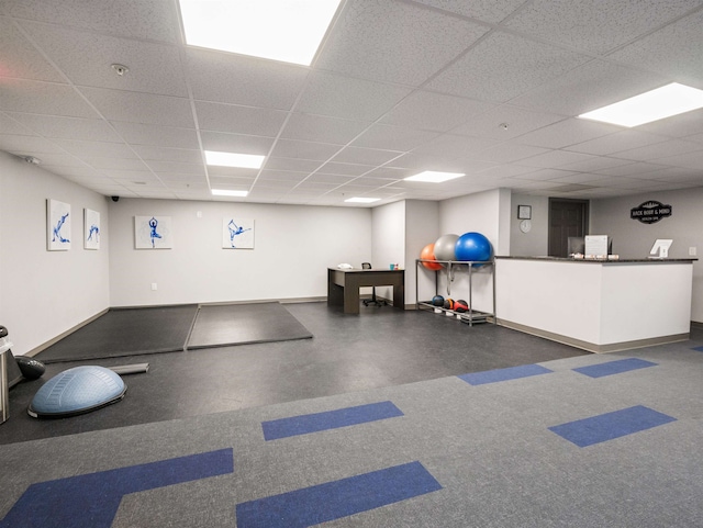 exercise room featuring a drop ceiling