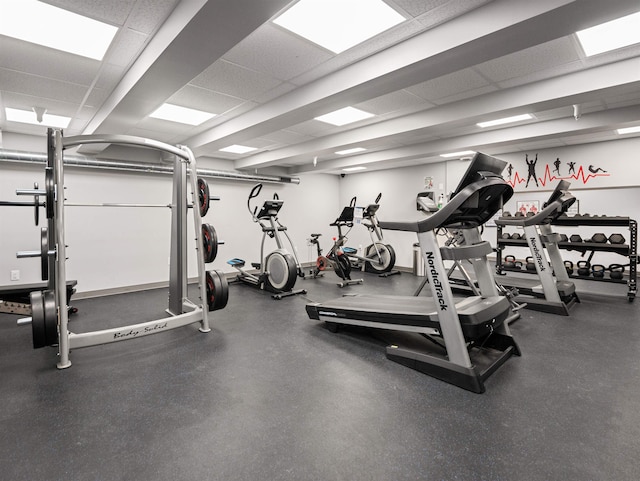 exercise room featuring a paneled ceiling