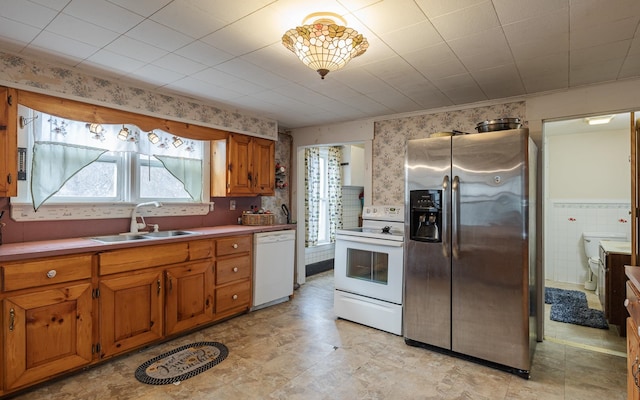 kitchen with white appliances and sink