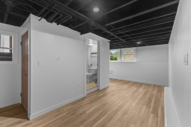 basement featuring light wood-type flooring