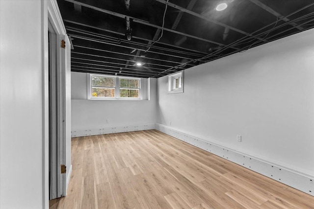 basement featuring hardwood / wood-style floors