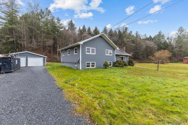 view of home's exterior featuring an outdoor structure, a yard, and a garage