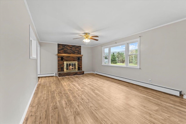 unfurnished living room featuring a fireplace, a baseboard radiator, and light hardwood / wood-style floors