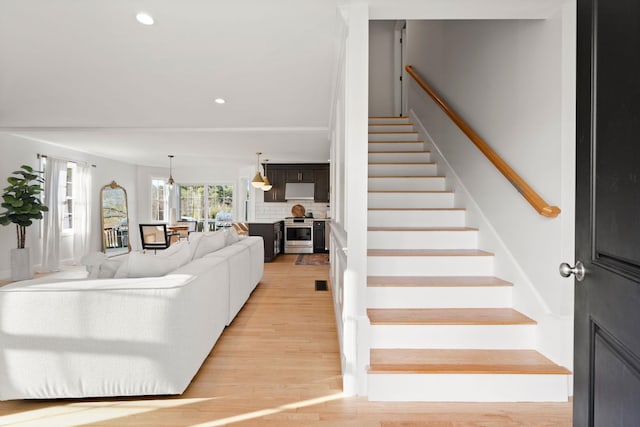 staircase with wood-type flooring