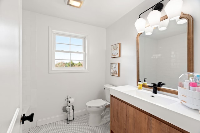 bathroom featuring vanity, toilet, walk in shower, and tile patterned flooring