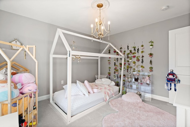 carpeted bedroom with a chandelier