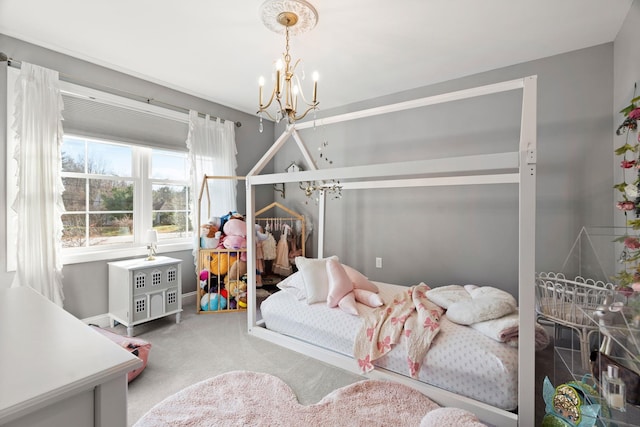 bedroom with carpet floors and an inviting chandelier