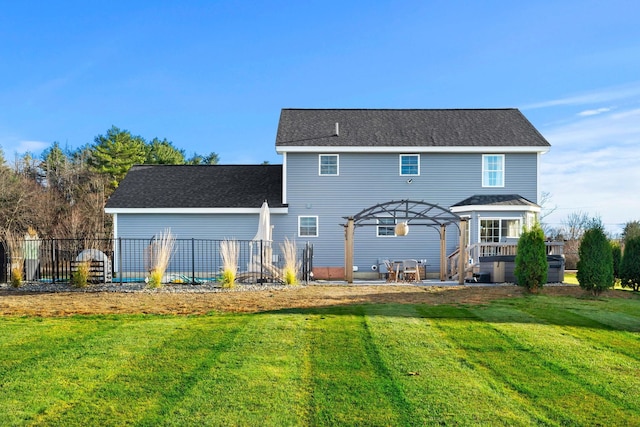 back of property with a pergola, a wooden deck, and a yard