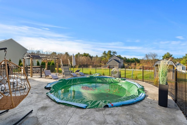 view of swimming pool featuring a pergola