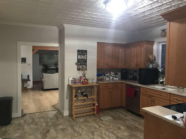 kitchen with light hardwood / wood-style floors, dishwasher, ornamental molding, and sink