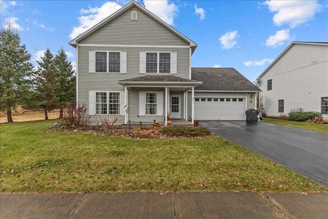 view of front property with a front yard and a garage