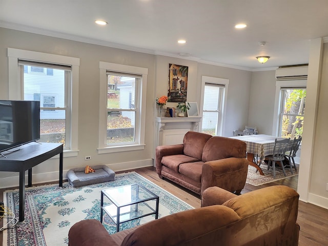 living room with plenty of natural light, ornamental molding, and hardwood / wood-style flooring