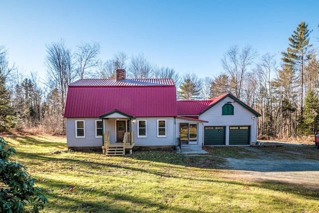 view of front of home featuring a garage and a front yard