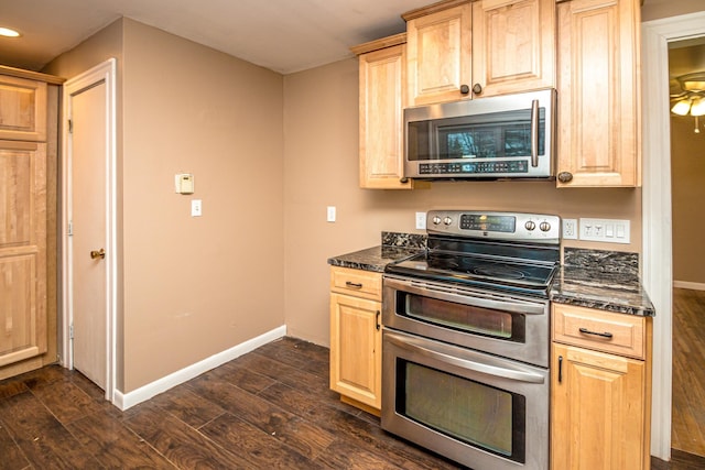390 Simonds Rd, Dalton, NH 03598 - kitchen with stainless steel appliances, light brown cabinetry, dark wood-style floors, baseboards, and recessed lighting