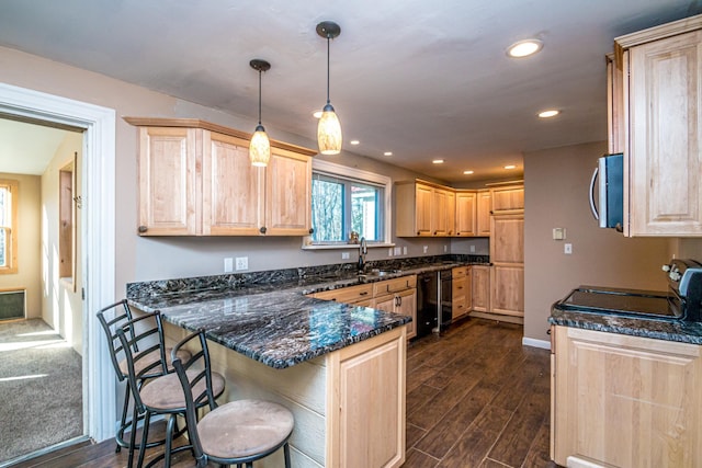 390 Simonds Rd, Dalton, NH 03598 - kitchen with light brown cabinetry, stainless steel microwave, a peninsula, and recessed lighting