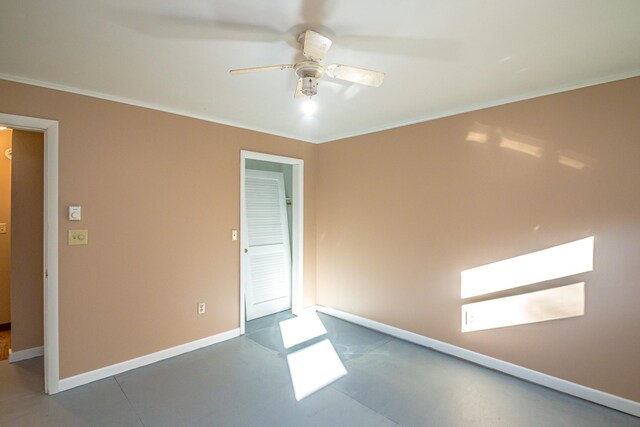 unfurnished bedroom featuring a closet, ceiling fan, and crown molding