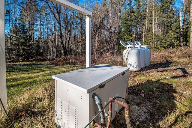 390 Simonds Rd, Dalton, NH 03598 - exterior view of a power unit and propane tank