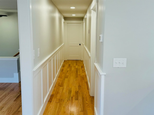 corridor with light wood-type flooring