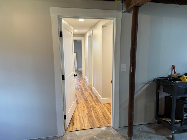 hall with hardwood / wood-style flooring