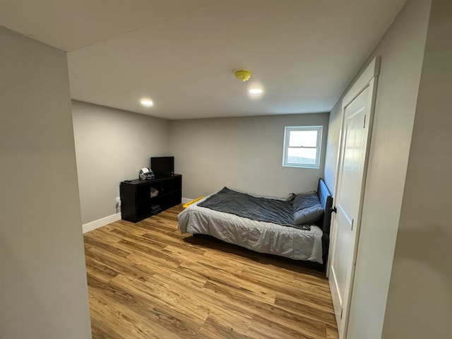 bedroom with light wood-type flooring