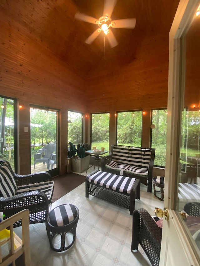 sunroom with a wealth of natural light, ceiling fan, and lofted ceiling