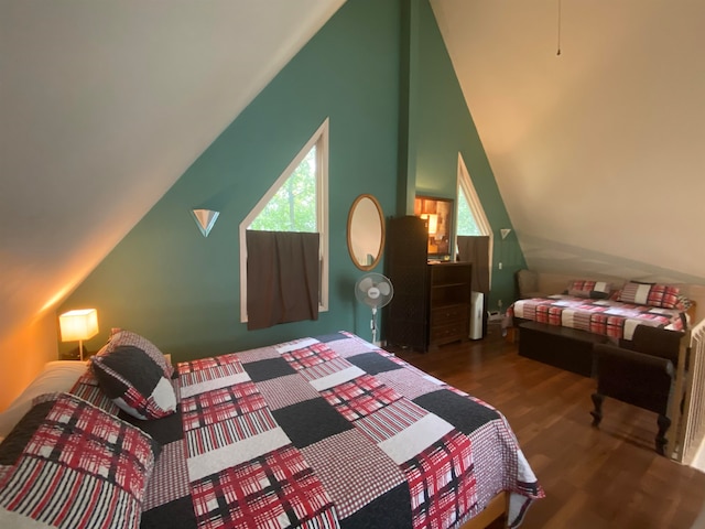 bedroom featuring dark hardwood / wood-style flooring and lofted ceiling