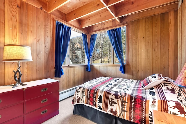 carpeted bedroom with baseboard heating, wood walls, and beamed ceiling