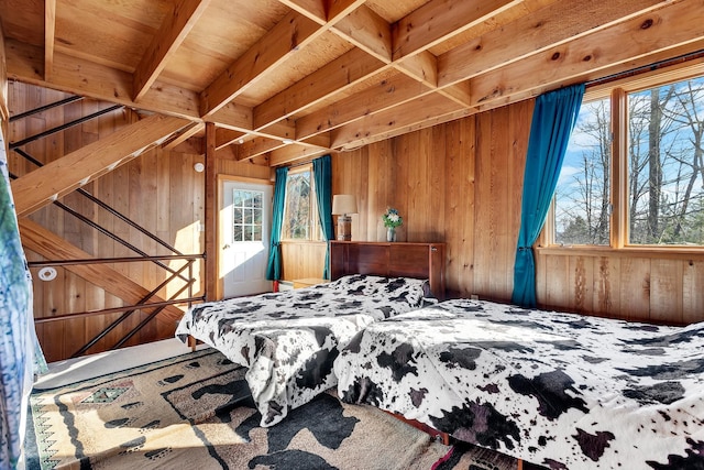 bedroom featuring wooden walls