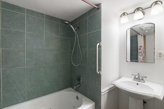 bathroom featuring shower / bath combo and sink