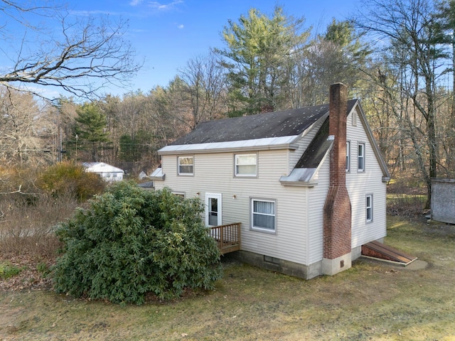 rear view of house with a yard