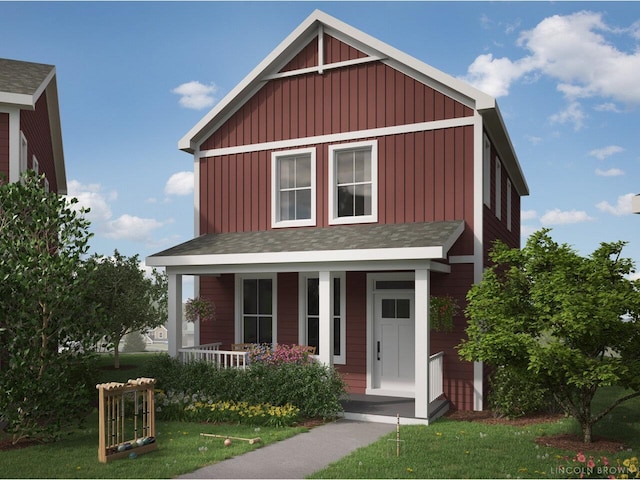 view of front of home with covered porch and a front yard